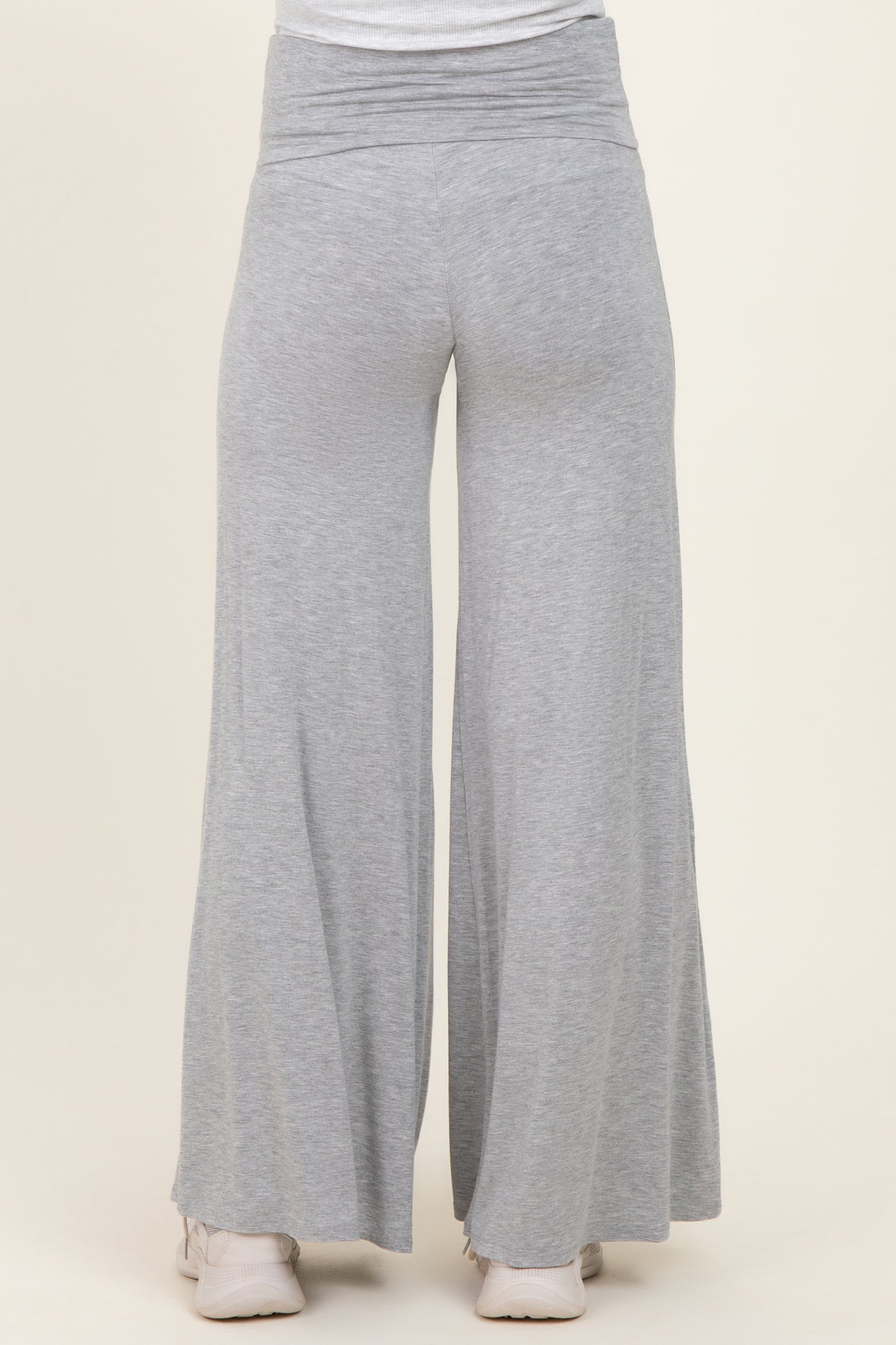 woman wearing gray maternity wide-leg pants with a high waist and relaxed fit