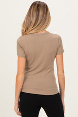 woman wearing a taupe short sleeve ribbed maternity top, viewed from the back
