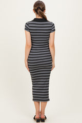 woman wearing a black and gray striped maternity dress with a fitted style and short sleeves, showing her back