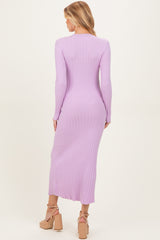 woman wearing a light purple ribbed maternity dress, showing long sleeves and a mid-calf length