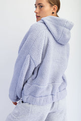 woman wearing a soft lavender oversized fleece hoodie with a hood and dropped shoulders