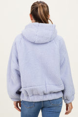 woman wearing a soft lavender maternity hoodie with a cozy, oversized fit and a hood, showing her back