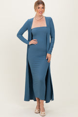woman wearing a teal ribbed maxi dress with a matching long cardigan and styled with wedge heels