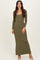 woman wearing a long sleeve olive green maxi dress with a square neckline and fitted silhouette