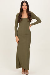woman wearing an olive green long sleeve maxi dress with a square neckline and form-fitting silhouette