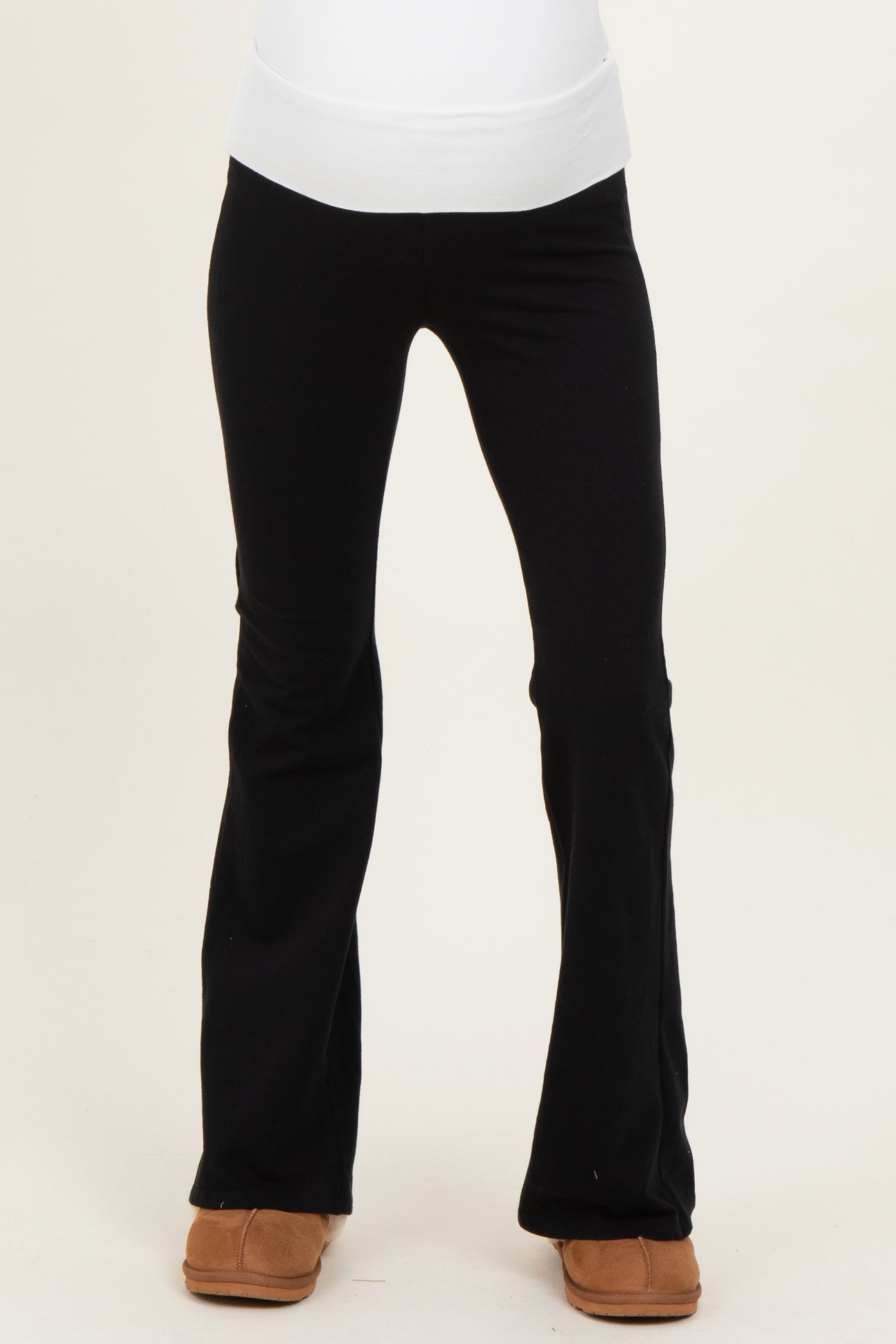 woman wearing black maternity leggings with a wide waistband