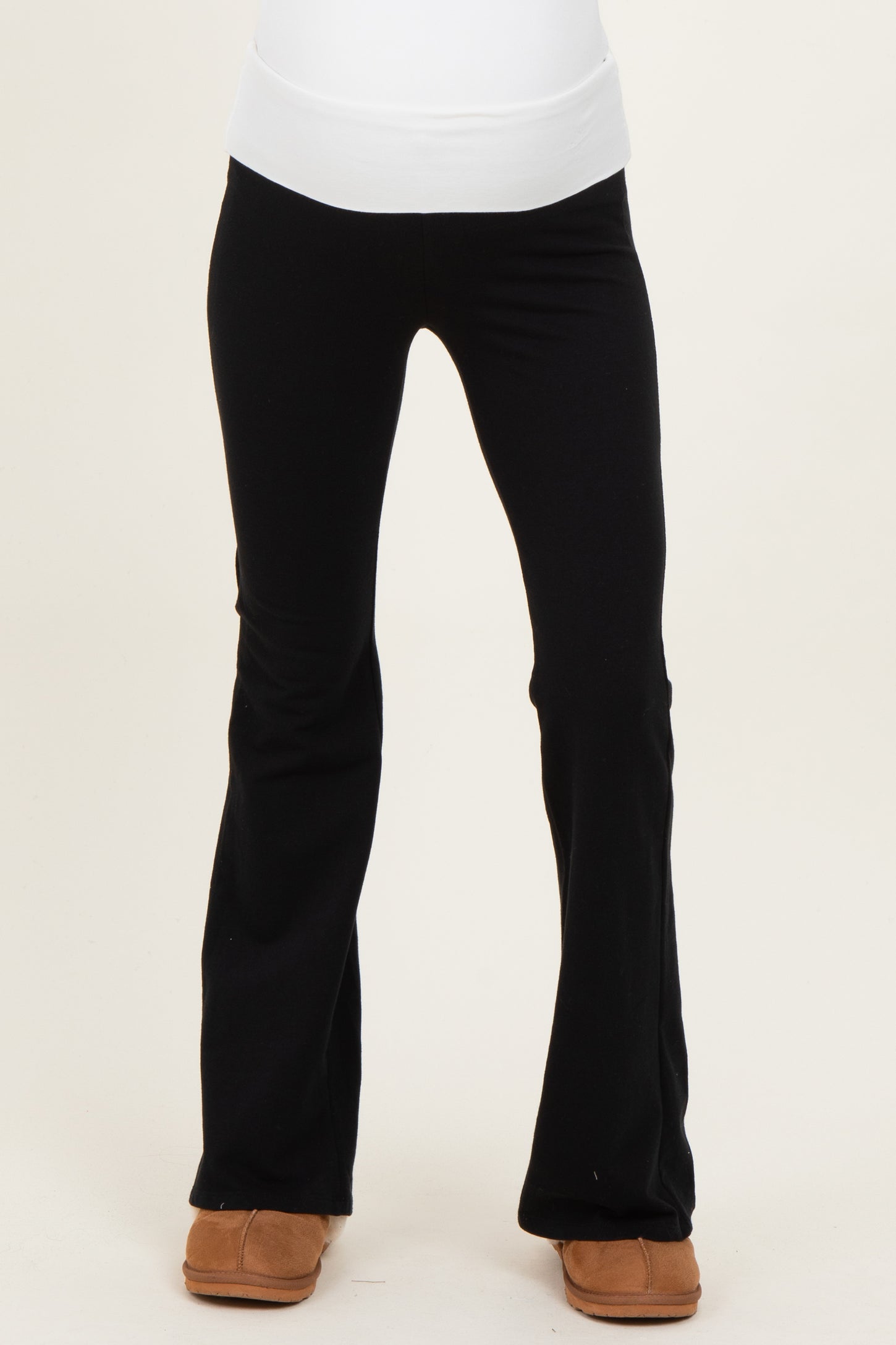 woman wearing black maternity leggings with a wide waistband