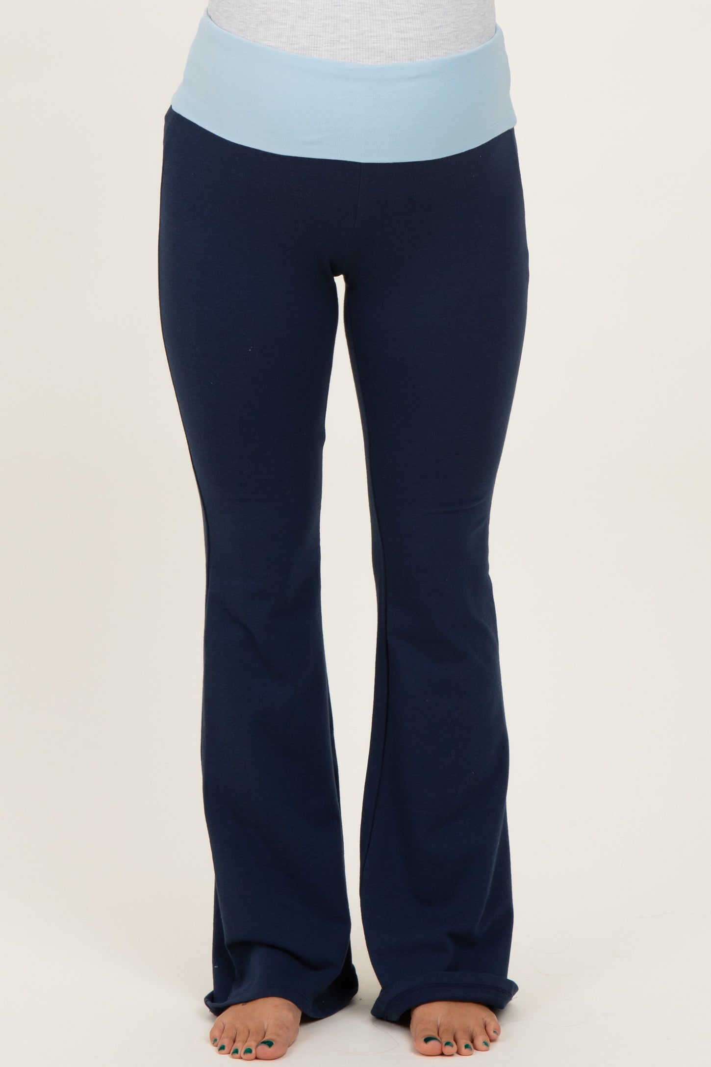 maternity wear navy blue flared pants with a light blue waistband, model not visible