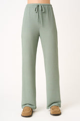 woman wearing light green ribbed wide-leg pants with an adjustable drawstring waistband