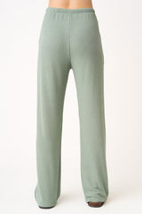 woman wearing light green ribbed wide-leg pants, shown from the back