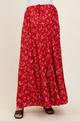 woman wearing a red floral print maxi skirt with an elastic waist and tiered ruffles, maternity wear