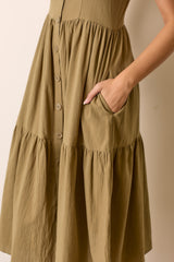 olive green button-down dress with tiered skirt and side pockets