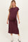 woman wearing a burgundy maternity dress with a side tie detail and a visible baby bump