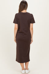 woman wearing a brown short sleeve maternity dress with a midi length, viewed from the back