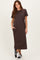 woman wearing a dark brown short sleeve maxi dress with pockets and black sneakers