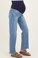 woman wearing maternity light blue wide-leg jeans with a dark blue panel and visible baby bump