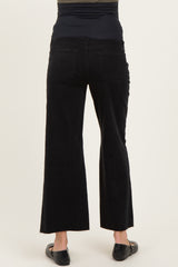 woman wearing black maternity wide-leg pants with a high waistband, viewed from the back