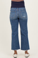 maternity wear dark wash flare jeans with a stretchy navy waistband, shown from the back