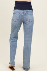 woman wearing light blue maternity jeans with a dark blue stretchy waistband, viewed from the back