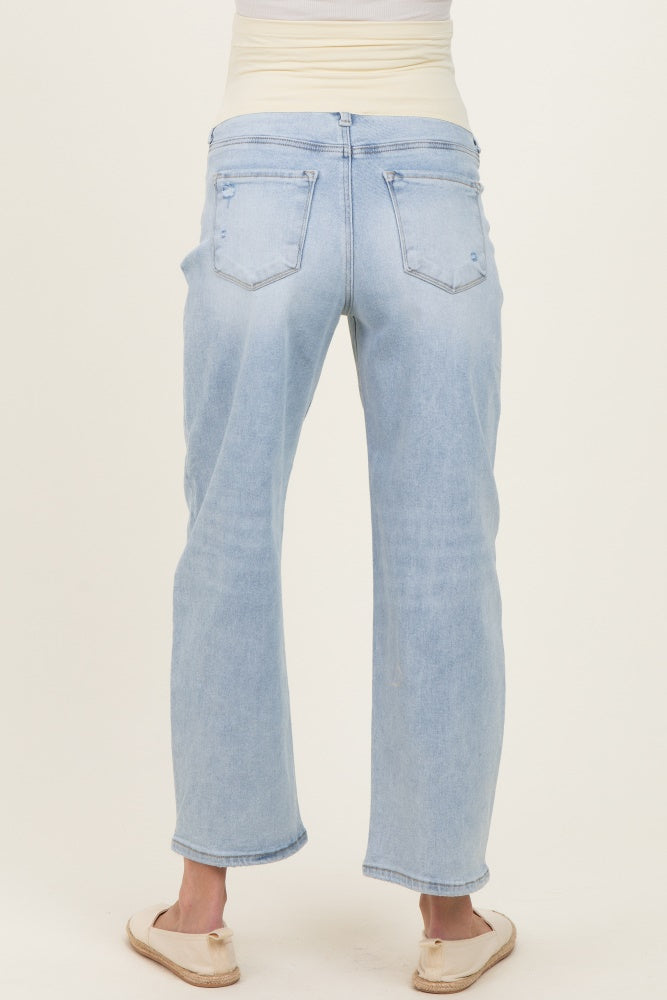 woman wearing light blue maternity jeans with a relaxed fit and elastic waistband, viewed from the back