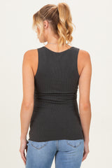 woman wearing a dark gray maternity tank top with a fitted style, showing a smooth back and no visible baby bump