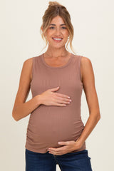 woman wearing a brown ribbed maternity tank top and holding her baby bump
