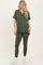 woman wearing an olive green v-neck oversized top with roll sleeves and matching olive green leggings
