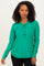 woman wearing a green long sleeve henley shirt with buttons and a curved hemline