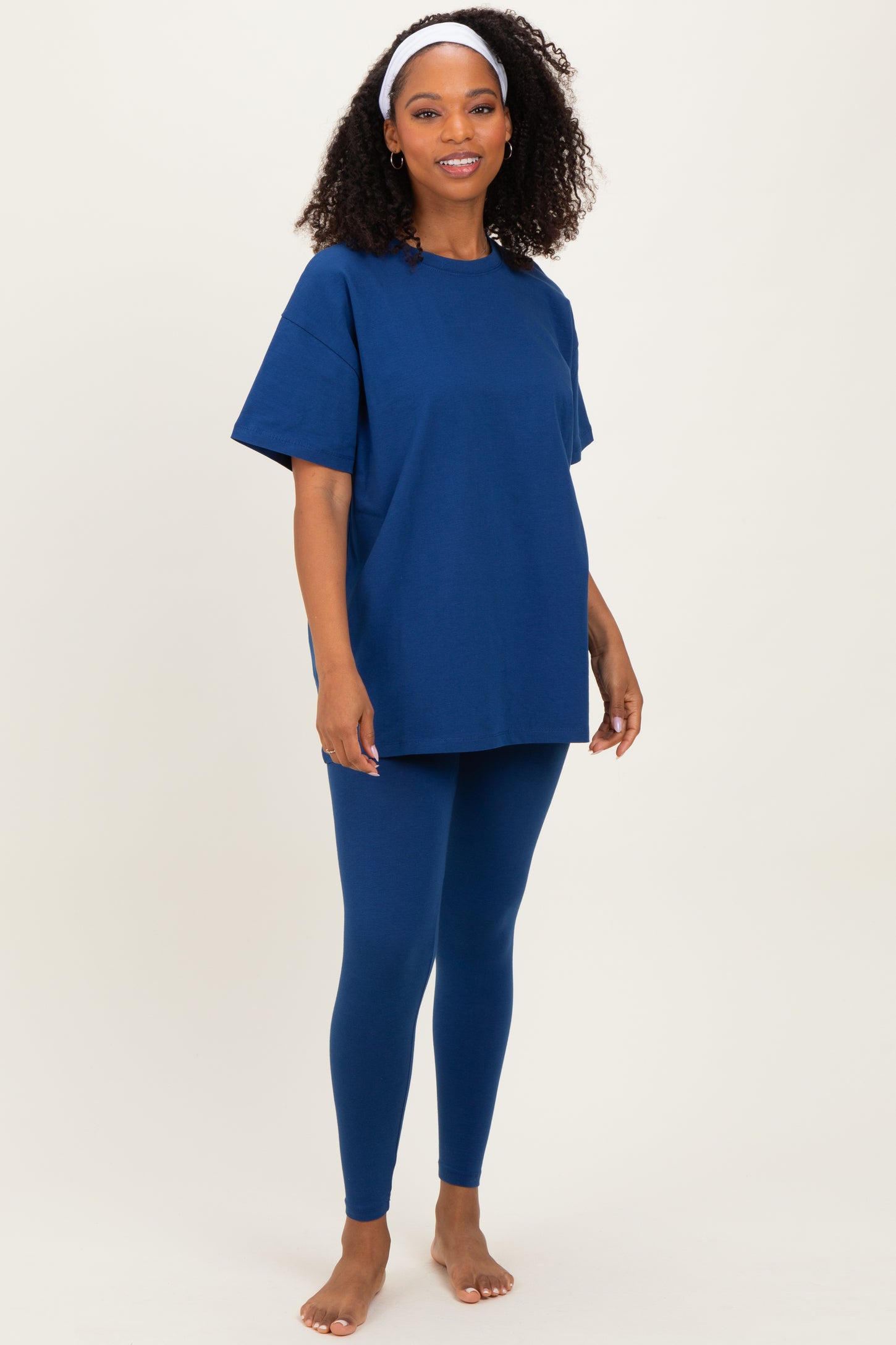 woman wearing a navy blue oversized t-shirt and matching leggings