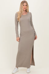 woman wearing a taupe ribbed long sleeve maxi dress with a side slit and white sneakers
