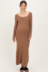 woman wearing a brown ribbed long sleeve maternity dress with a visible baby bump