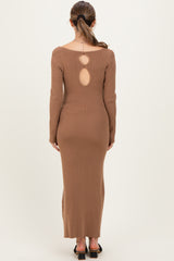 woman wearing a brown ribbed maternity dress with a keyhole back detail and long sleeves