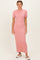 woman wearing a pink ribbed maxi dress with short sleeves and a fitted silhouette