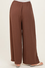 brown striped wide-leg pants with an elastic waistband and a relaxed fit, shown from the back
