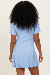 woman wearing a light blue ribbed knit short sleeve dress with a slightly flared hem and back view visible