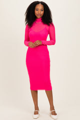 woman wearing a bright pink long sleeve bodycon dress with a high neck and sheer overlay
