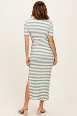 woman wearing a striped midi dress with short sleeves and a side slit, viewed from the back