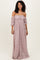 woman wearing a pink off-the-shoulder maxi dress with puff sleeves and floral pattern