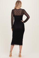 woman wearing a black lace long sleeve midi dress with a fitted silhouette and sheer back details