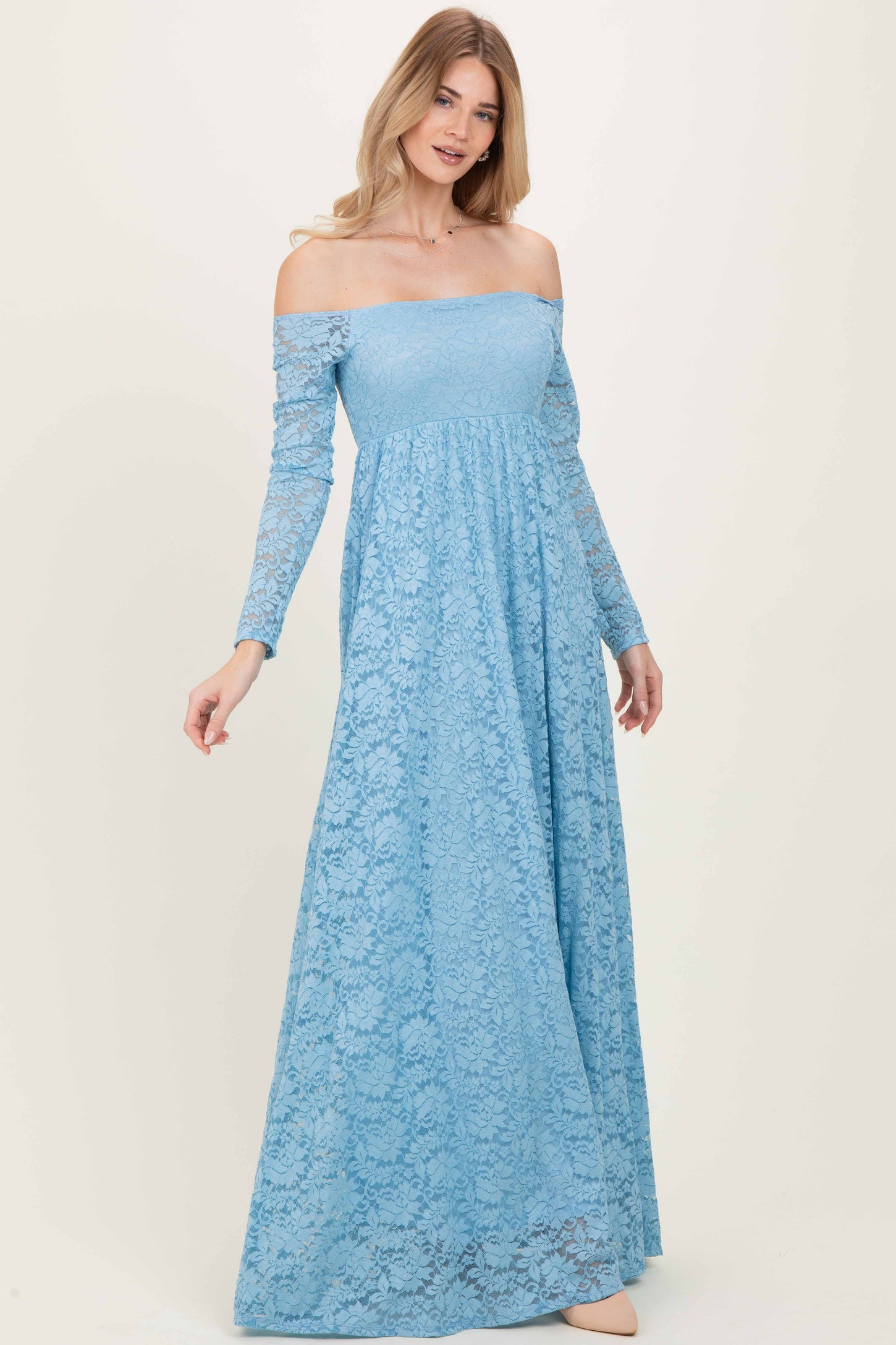 woman wearing a light blue off-shoulder long sleeve lace maxi dress