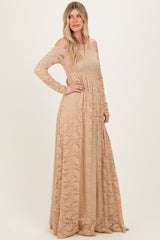 woman wearing a long sleeve off-the-shoulder beige lace maxi dress