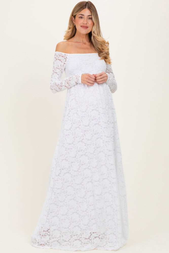 woman wearing a white off-the-shoulder long sleeve lace maternity dress with a flowing skirt and a relaxed fit