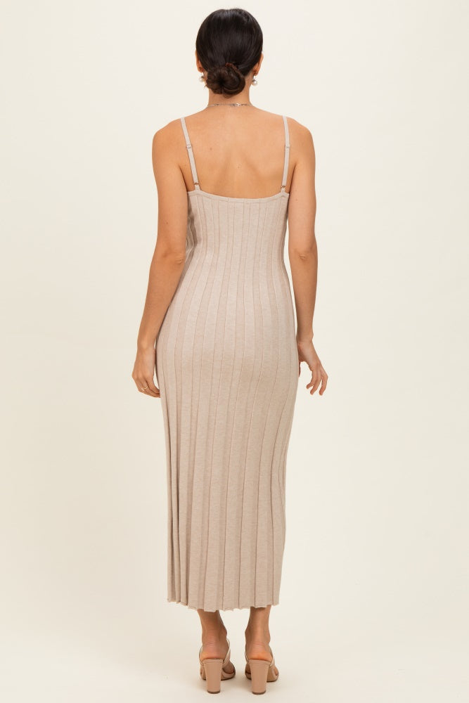 woman wearing a light beige ribbed maxi dress with spaghetti straps, showing the back view