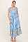 woman wearing a blue and white striped maxi dress with tie straps and floral print at the hem