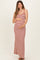 woman wearing a red and white striped maternity maxi dress and holding her baby bump