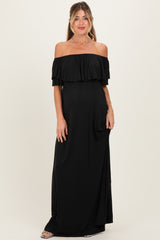 woman wearing a black off-shoulder maternity maxi dress showcasing her baby bump