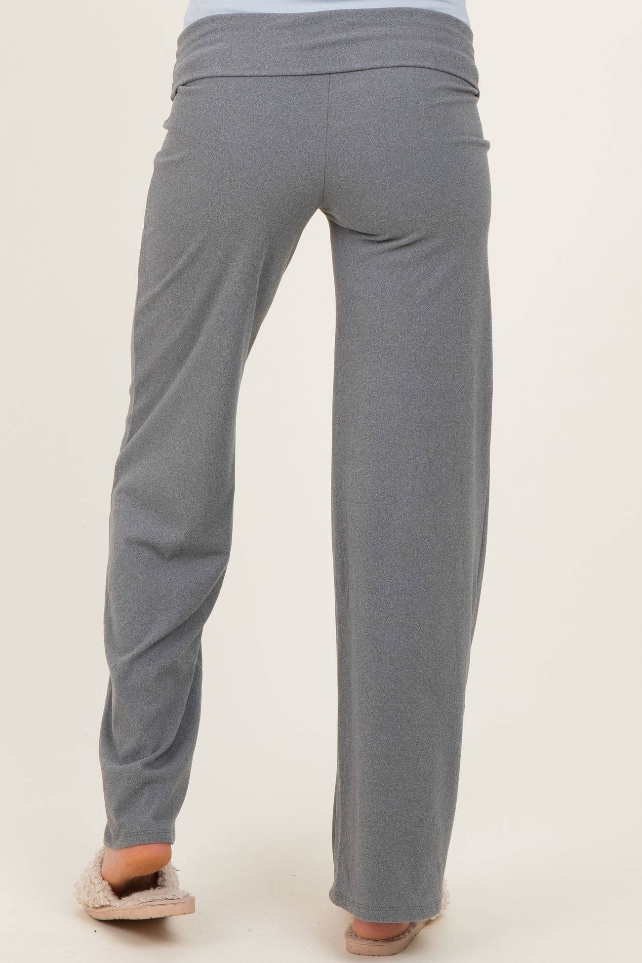 woman wearing gray maternity lounge pants, view from the back