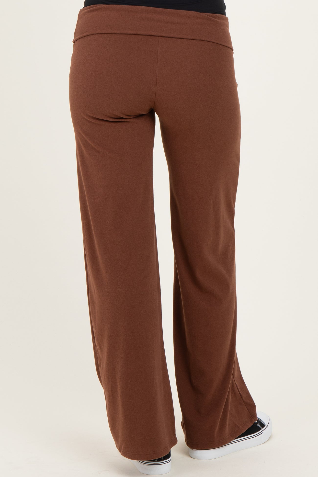 woman wearing brown maternity wide-leg pants, view from the back