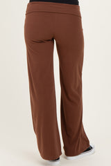woman wearing brown maternity wide-leg pants, view from the back