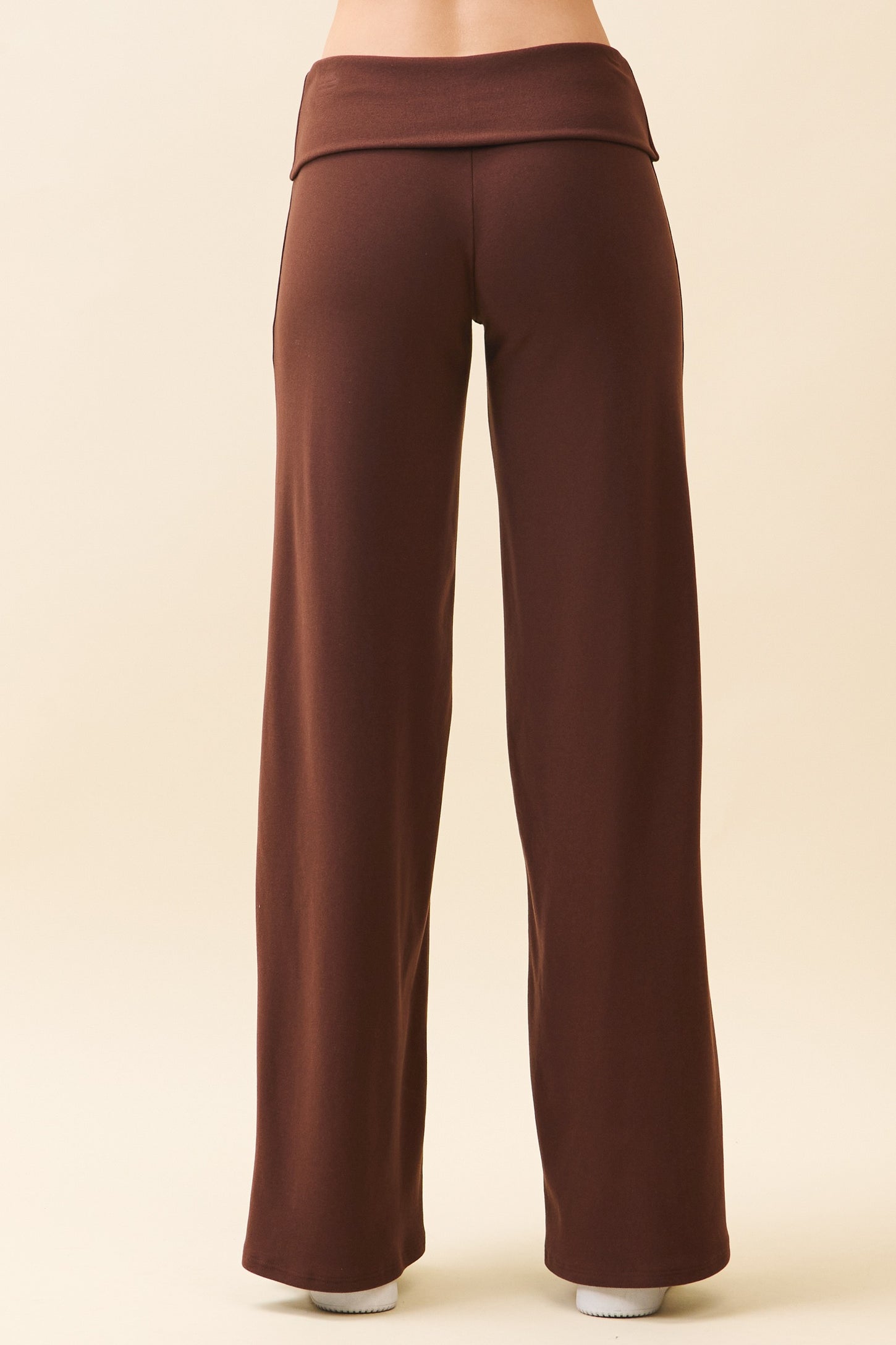 woman wearing brown wide-leg lounge pants, viewed from the back